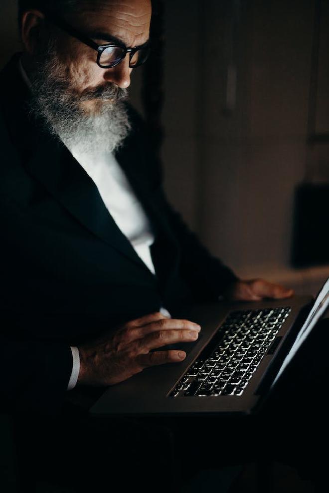 A man writing an email.